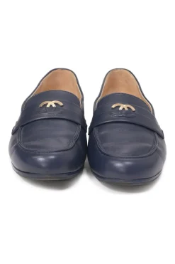 Navy leather penny-style slip-on loafers featuring silver-finish metallic Coco Mark plaque