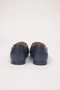 Navy leather penny-style slip-on loafers featuring silver-finish metallic Coco Mark plaque