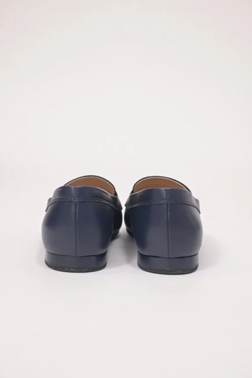 Navy leather penny-style slip-on loafers featuring silver-finish metallic Coco Mark plaque