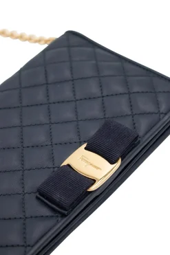 Navy leather puffed cross-body bag with gold tone chain