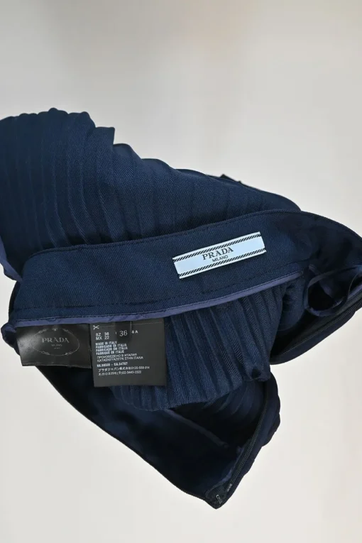 Navy polyester twill plissé A-line skirt with belt loop waistband