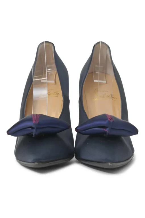 Navy satin pointed toe pumps featuring pillowed top accents
