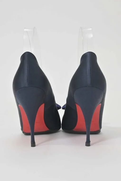 Navy satin pointed toe pumps featuring pillowed top accents