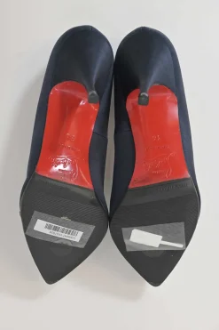 Navy satin pointed toe pumps featuring pillowed top accents