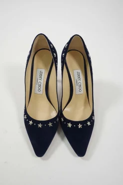 Navy star-studded suede and leather pointed toe pumps