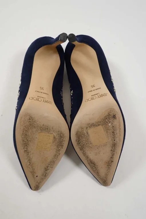 Navy star-studded suede and leather pointed toe pumps