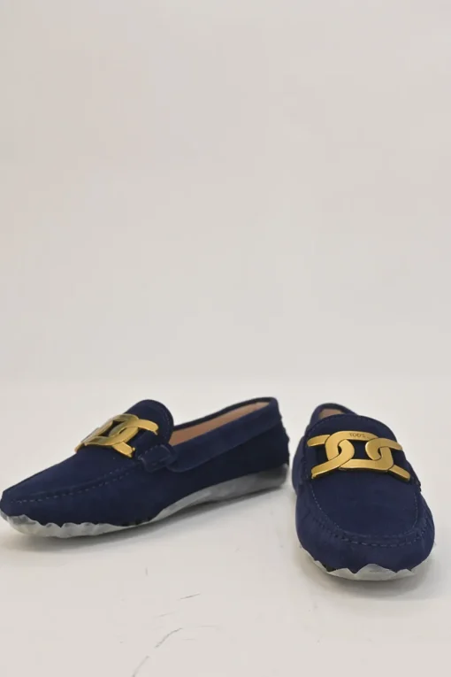 Navy suede Kate round-toe slip-on driving loafers with branded chainlink vamp buckle appliqué and signature Gommino soles