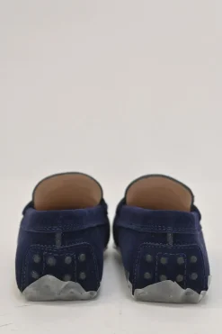 Navy suede Kate round-toe slip-on driving loafers with branded chainlink vamp buckle appliqué and signature Gommino soles