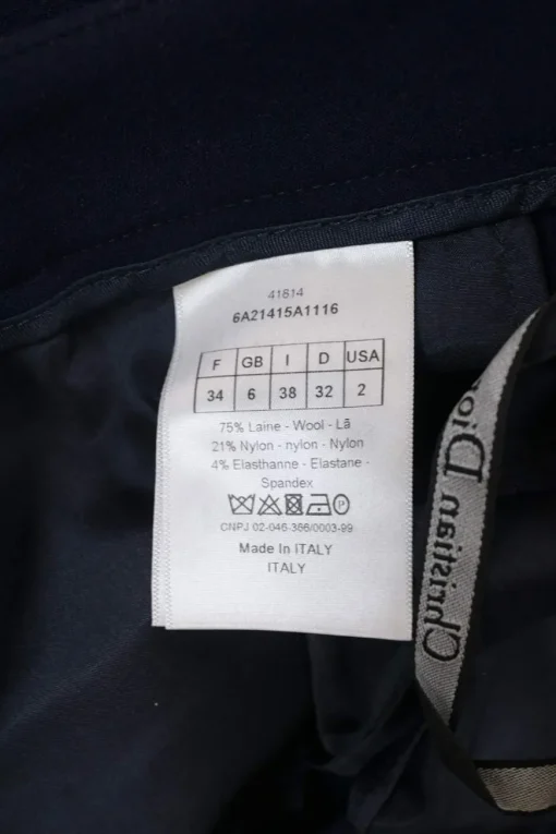 Navy wool-blend single breasted notch lapel bar jacket and tapered leg tailored trousers