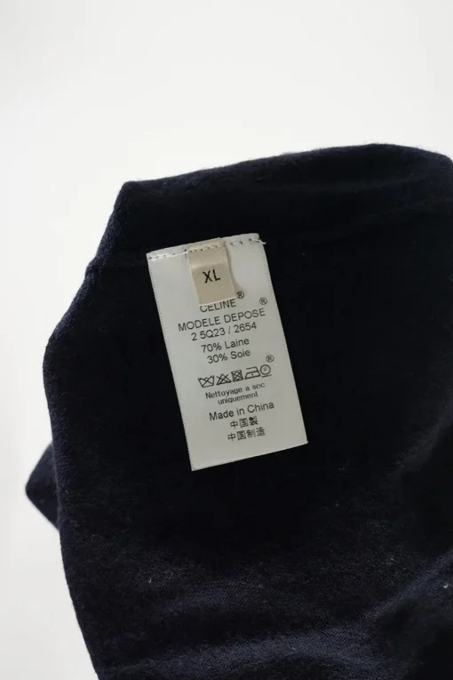 Navy wool-silk blend button-front cardigan with triomphe embroidery detail along forepart panel