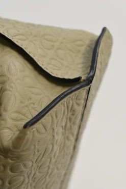 Neutral anagram-embossed leather tote with detachable shoulder strap
