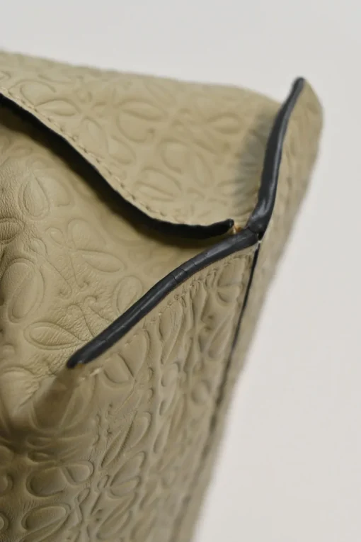 Neutral anagram-embossed leather tote with detachable shoulder strap