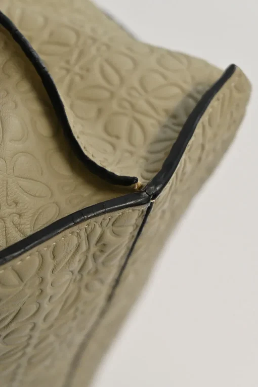 Neutral anagram-embossed leather tote with detachable shoulder strap