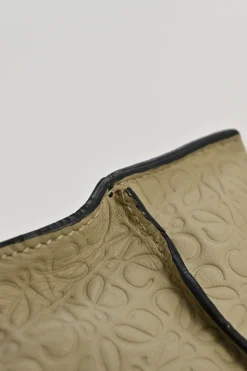 Neutral anagram-embossed leather tote with detachable shoulder strap