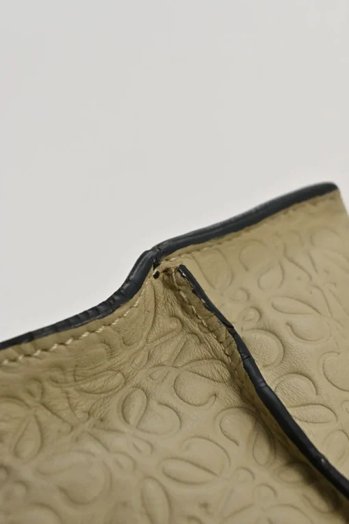 Neutral anagram-embossed leather tote with detachable shoulder strap