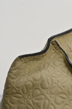 Neutral anagram-embossed leather tote with detachable shoulder strap
