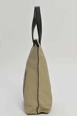 Neutral anagram-embossed leather tote with detachable shoulder strap
