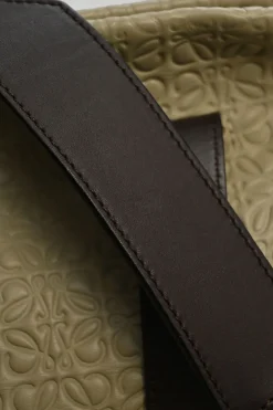 Neutral anagram-embossed leather tote with detachable shoulder strap