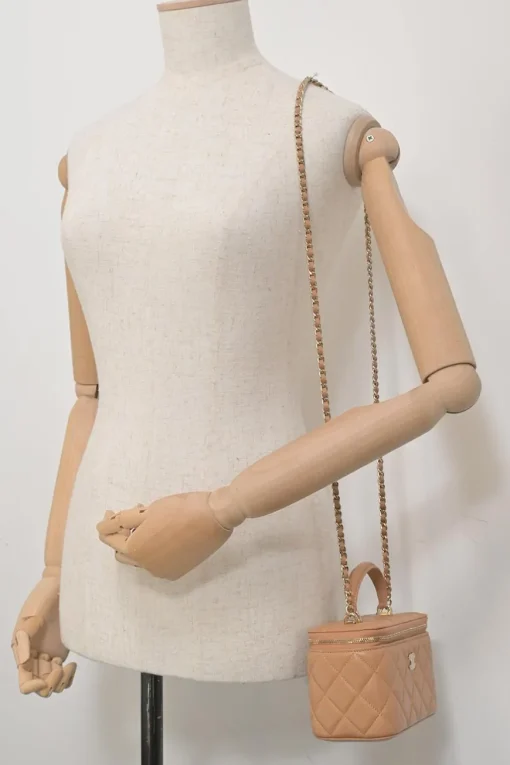 Neutral matelassé lambskin leather top handle vanity case with chain
