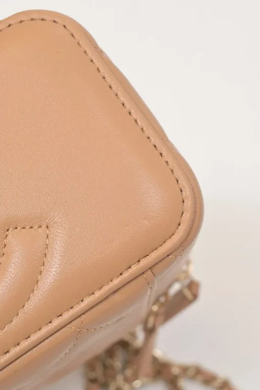 Neutral matelassé lambskin leather top handle vanity case with chain