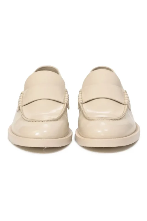 Nude brushed calfskin loafers featuring silver-finish metal logo lettering on heel