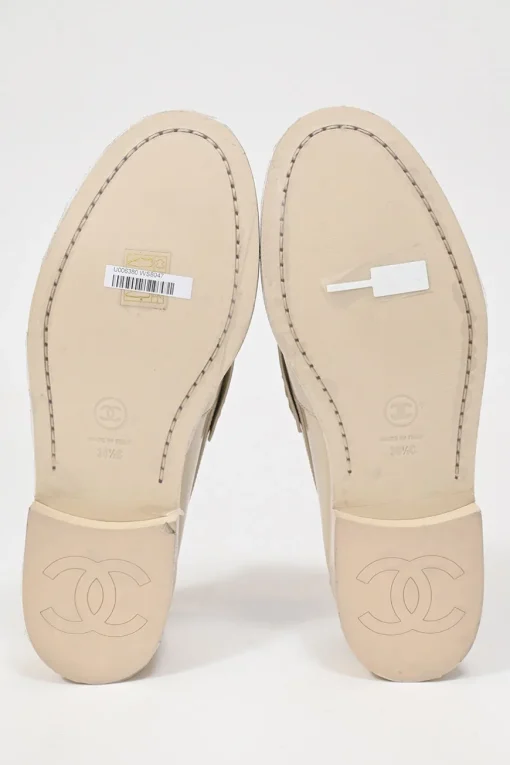 Nude brushed calfskin loafers featuring silver-finish metal logo lettering on heel