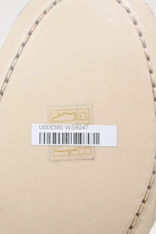 Nude brushed calfskin loafers featuring silver-finish metal logo lettering on heel