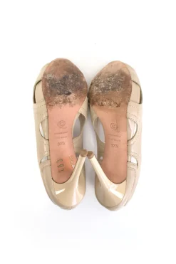 Nude leather peep-toe high-heel with cutout details and embroidered accents