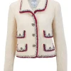Off white wool silk blend jacket and skirt suit with red and navy knit piping and embellished buttons