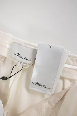 Off-white mid-waist tapered dress pants with slits at hem