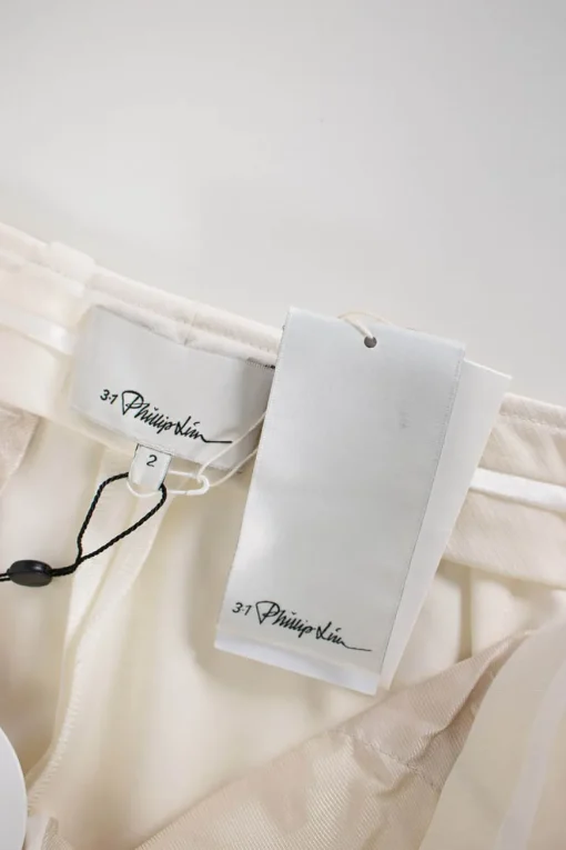 Off-white mid-waist tapered dress pants with slits at hem