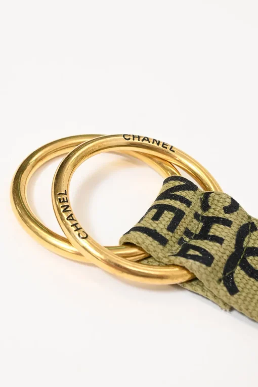 Olive canvas CC belt featuring gold-finish hardware