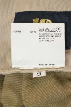 Olive cotton camouflage print pull-on pleat-front trousers