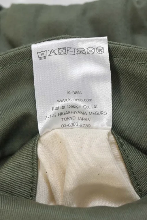 Olive green cotton gabardine relaxed tuck pleat straight-leg chinos with drawstring waist