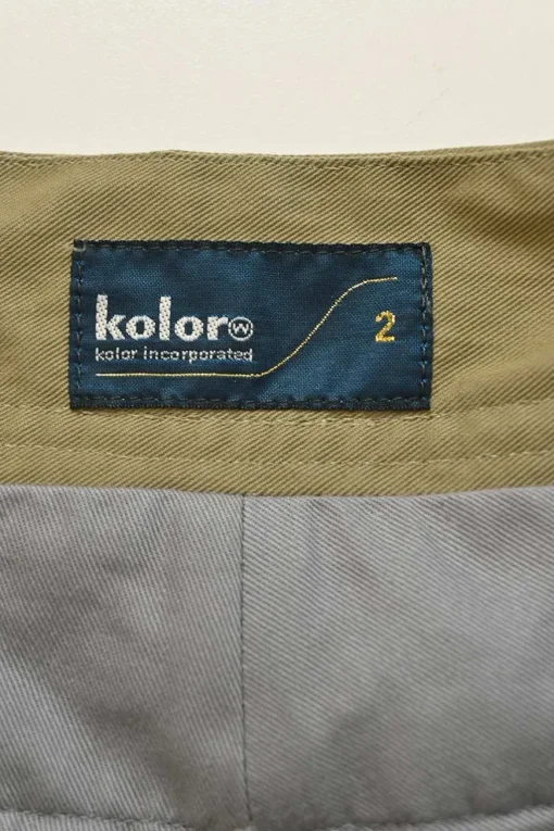 Olive green twill pull-on empire-waist belted wide-leg cargo trousers with multi-colour braided cord waistband appliqué