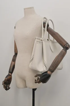 Optic white laser-cut leather Angèle 32 shopper tote