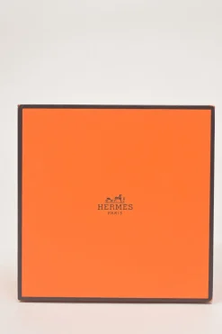 Orange Barenia calfskin and steel Médor watch featuring Swiss-made quartz movement and opaline silvered dial