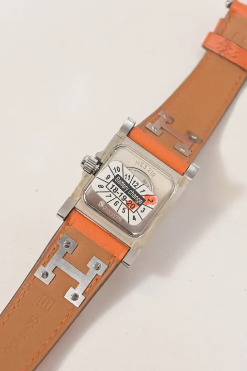 Orange Barenia calfskin and steel Médor watch featuring Swiss-made quartz movement and opaline silvered dial
