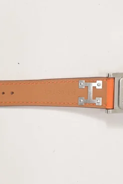 Orange Barenia calfskin and steel Médor watch featuring Swiss-made quartz movement and opaline silvered dial