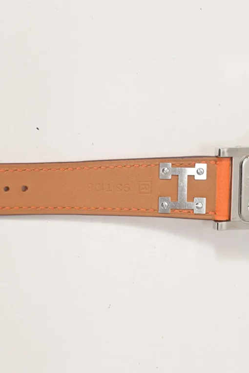 Orange Barenia calfskin and steel Médor watch featuring Swiss-made quartz movement and opaline silvered dial