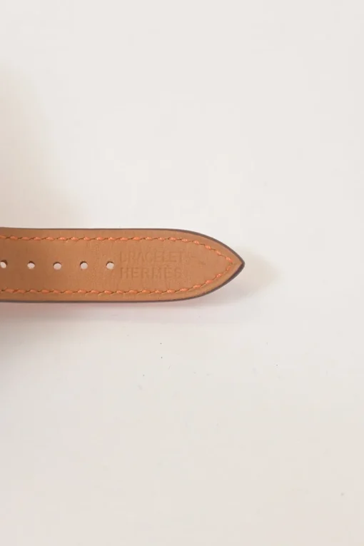Orange Barenia calfskin and steel Médor watch featuring Swiss-made quartz movement and opaline silvered dial