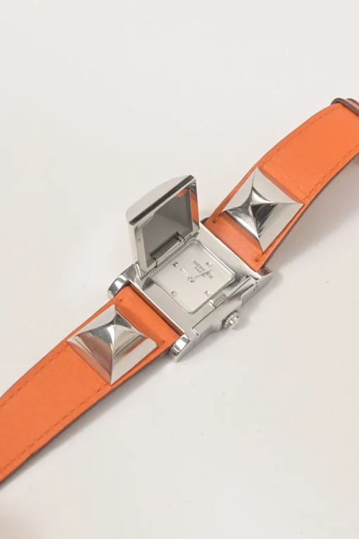 Orange Barenia calfskin and steel Médor watch featuring Swiss-made quartz movement and opaline silvered dial