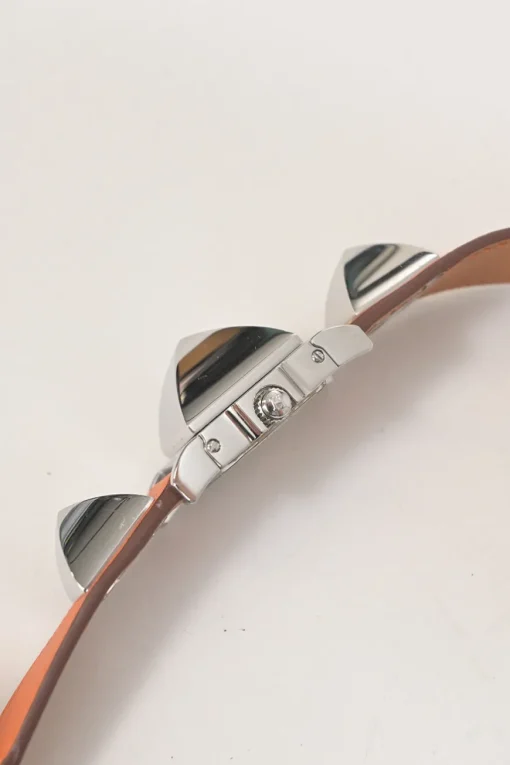 Orange Barenia calfskin and steel Médor watch featuring Swiss-made quartz movement and opaline silvered dial