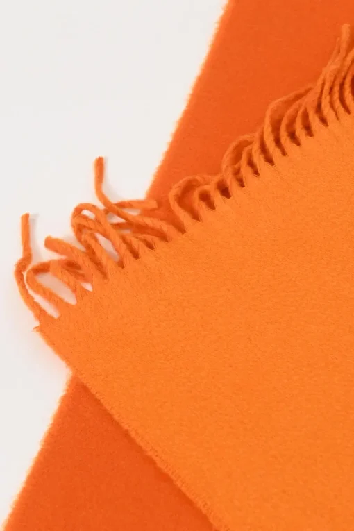 Orange cashmere double-face fringe stole featuring "Hermès Sellier Paris" broderie motif