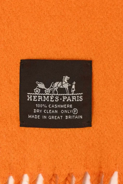 Orange cashmere double-face fringe stole featuring "Hermès Sellier Paris" broderie motif