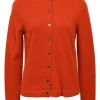 Orange cashmere jersey knit two-piece set with sleeveless turtleneck and crewneck button-front cardigan