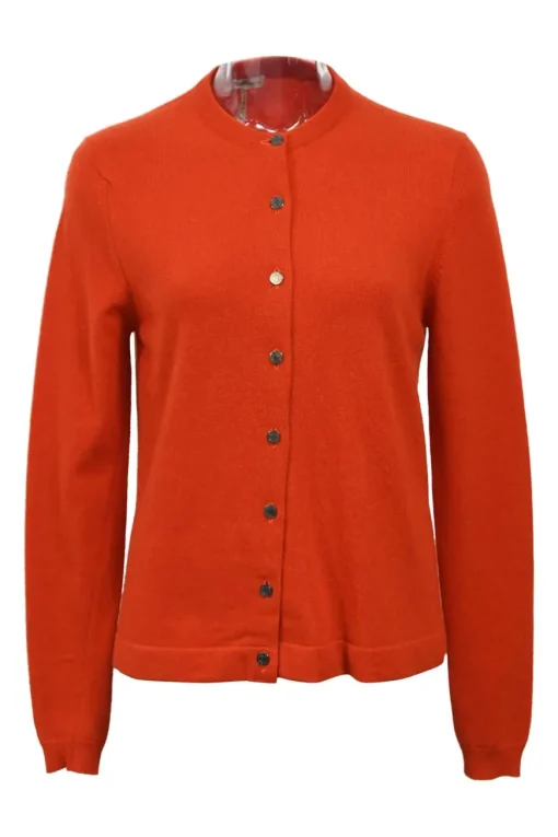 Orange cashmere jersey knit two-piece set with sleeveless turtleneck and crewneck button-front cardigan
