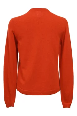 Orange cashmere jersey knit two-piece set with sleeveless turtleneck and crewneck button-front cardigan