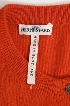 Orange cashmere jersey knit two-piece set with sleeveless turtleneck and crewneck button-front cardigan
