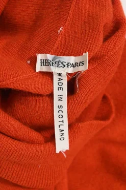 Orange cashmere jersey knit two-piece set with sleeveless turtleneck and crewneck button-front cardigan